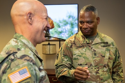 Command Sgt. Maj. John Sampa, 12th Command Sergeant Major of the Army National Guard, right, and Maj. Gen. David C. Coburn, U.S. Army Financial Management Command commanding general, share a moment at the Maj. Gen. Emmett J. Bean Federal Center in Indianapolis June 6, 2019. During his visit, Sampa also met with Command Sgt. Maj. Courtney Ross, USAFMCOM command sergeant major and William Staley, USAFMCOM deputy to the commanding general, to discuss building stronger partnerships between Regular Army and National Guard financial management Soldiers. (U.S. Army photo by Mark R. W. Orders-Woempner)