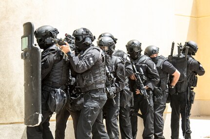 Members of the Kuwait Ministry of Interior’s Special Weapons and Tactics team prepare to breach a building while pulling security on May 2, 2019, during a joint exercise with a simulated terrorist, explosive ordnance, and chemical situation at the Kuwait Special Forces Training Center. The exercise was crafted to build a shared understanding of Kuwait Civil Authorities and U.S. forces procedures while reacting to any disaster, natural and manmade alike.