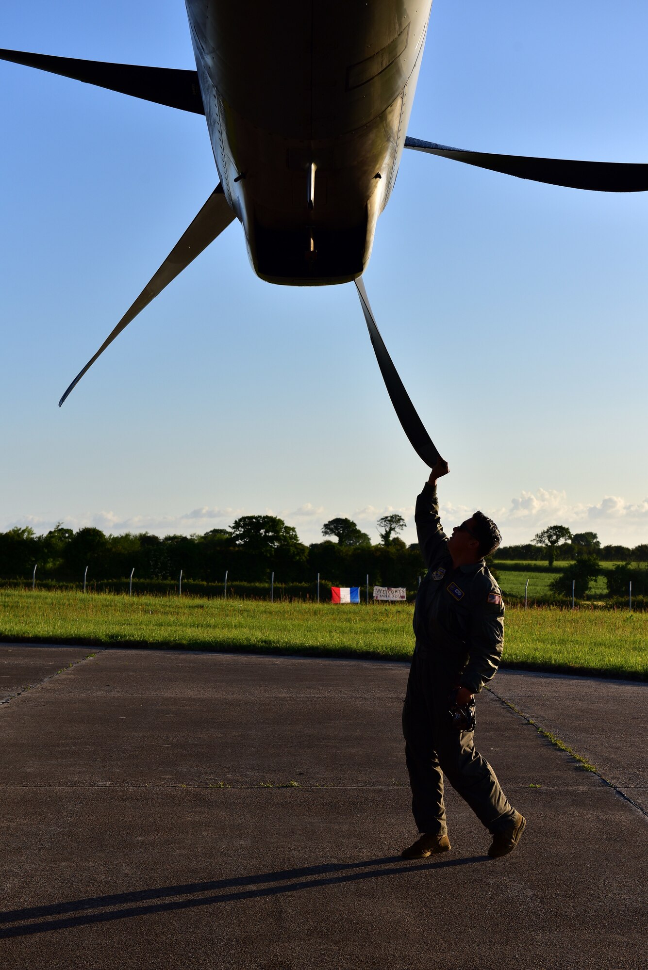 An Airman inspects the prop of a C-130J