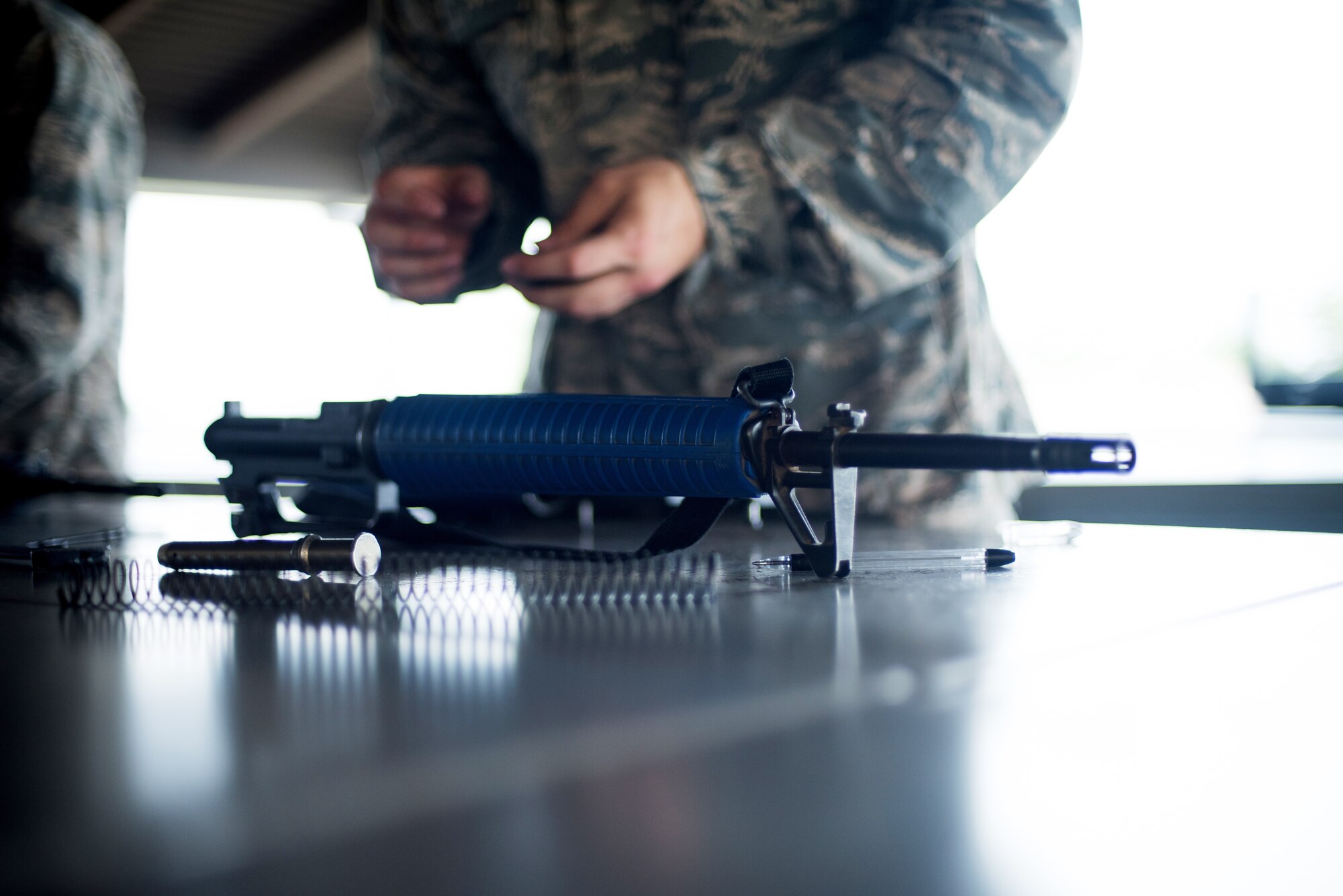 U.S. Air Force basic military training trainees practice assembling and disassembling their M-16 trainer weapon, May 2, 2019, at Joint Base San Antonio-Lackland. Starting this summer the M16 rifle will be phased out for the M4, BMT is set to receive close to 9,000 M4 training rifles. (U.S. Air Force photo by Sarayuth Pinthong)