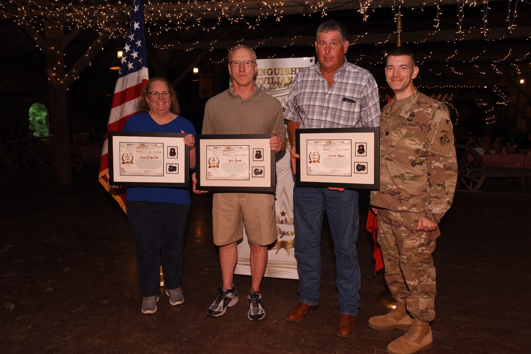 Lt. Col. Cullen Jones (Far Right), U.S. Army Corps of Engineers Nashville District commander, poses with Emily Carr, Michael Zoccola (Second from Left), and Charles Bryan, all recipients of the Distinguished Civilian Employee Recognition Award during the Engineer Day Picnic June 7, 2019 in Ridgetop, Tenn. The award recognizes exceptional retirees who have served honorably and contributed substantially to the reputation of the Corps of Engineers. (USACE photo by Lee Roberts)