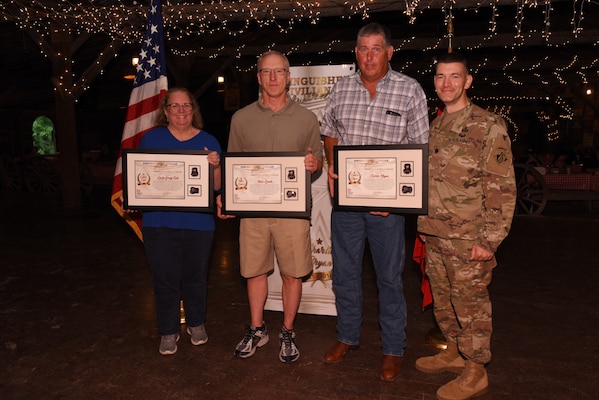 Lt. Col. Cullen Jones (Far Right), U.S. Army Corps of Engineers Nashville District commander, poses with Emily Carr, Michael Zoccola (Second from Left), and Charles Bryan, all recipients of the Distinguished Civilian Employee Recognition Award during the Engineer Day Picnic June 7, 2019 in Ridgetop, Tenn. The award recognizes exceptional retirees who have served honorably and contributed substantially to the reputation of the Corps of Engineers. (USACE photo by Lee Roberts)