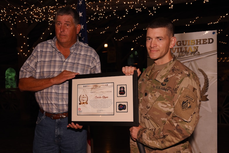 Lt. Col. Cullen Jones (Right), U.S. Army Corps of Engineers Nashville District commander, presents the Distinguished Civilian Employee Recognition Award to Charles Bryan during the Engineer Day Picnic June 7, 2019 in Ridgetop, Tenn. Bryan served in the Nashville District from 1981 to 2016. The award recognizes exceptional retirees who have served honorably and contributed substantially to the reputation of the Corps of Engineers. (USACE photo by Lee Roberts)