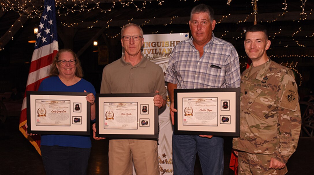 Lt. Col. Cullen Jones (Far Right), U.S. Army Corps of Engineers Nashville District commander, poses with Emily Carr, Michael Zoccola (Second from Left), and Charles Bryan, all recipients of the Distinguished Civilian Employee Recognition Award during the Engineer Day Picnic June 7, 2019 in Ridgetop, Tenn. The award recognizes exceptional retirees who have served honorably and contributed substantially to the reputation of the Corps of Engineers. (USACE photo by Lee Roberts)