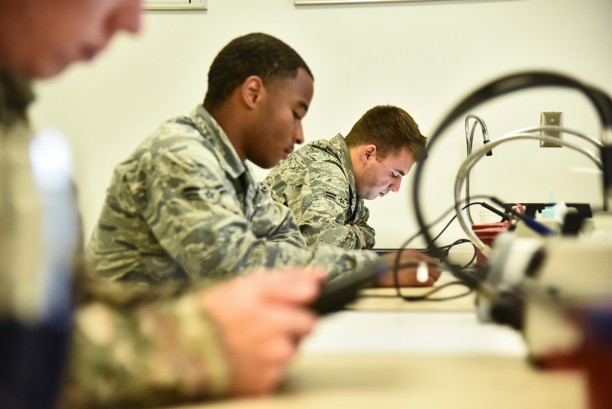 Students assigned to the 372d Training Squadron, Detachment 11, attend an advanced wire maintenance course at Davis-Monthan Air Force Base, Ariz., June 4, 2019. The 372d TRS, Det. 11, is a unit specifically dedicated to improving maintenance Airmen skills surrounding the many lethal aircraft assigned to the 355th Wing at D-M. (U.S. Air Force photo by Senior Airman Mya M. Crosby)