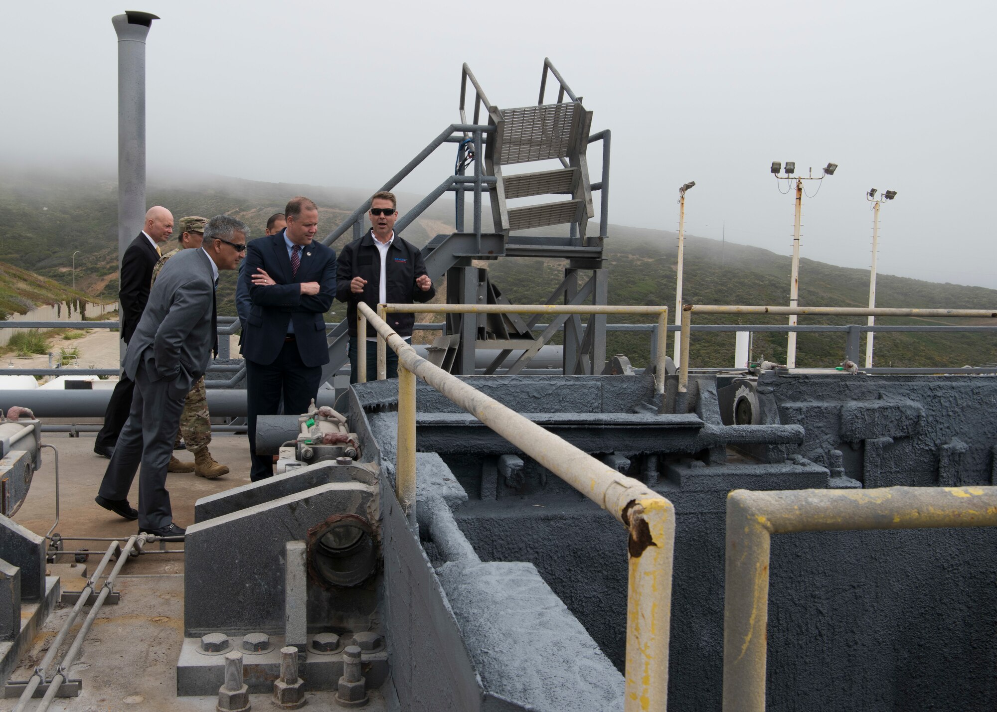 Eric Krystkowiak, Vandenberg SpaceX Launch Site Operations director, shows the NASA administrator a SpaceX transporter erector June 3, 2019, at Vandenberg Air Force Base, Calif. The Department of Defense Manned Space Flight Support Office coordinates all United States Department of Defense contingency support to United States NASA manned space flight programs. (U.S. Air Force photo by Airman 1st Class Aubree Milks)