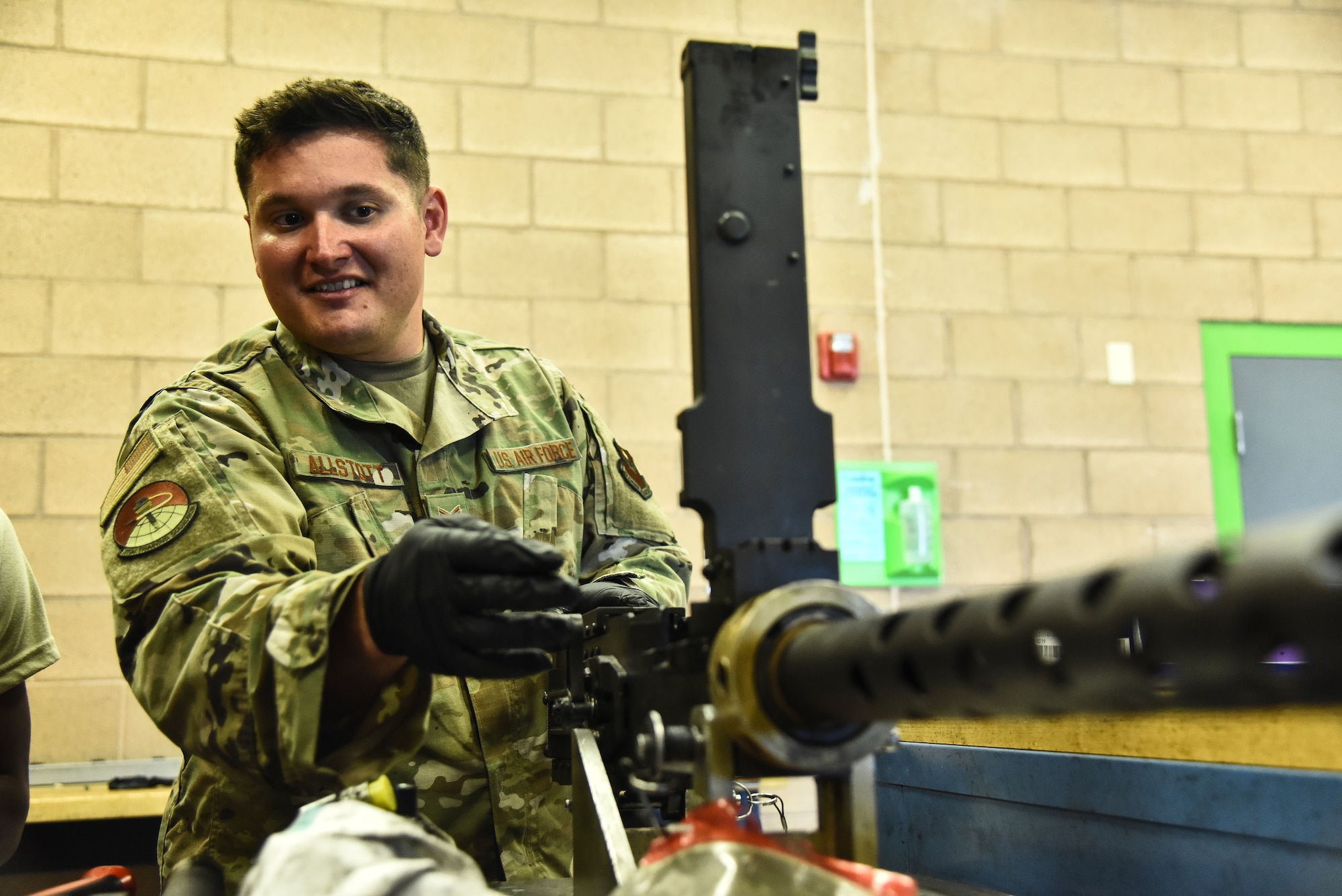 Tech. Sgt. Joe Allstott, 372d Training Squadron, Detachment 11, A-10C Thunderbolt II and HH-60G Pavehawk weapons instructor, demonstrates how to clean a GAU-18 at Davis-Monthan Air Force Base, Ariz., June 4, 2019. The 372d TRS, Det. 11, consists of 42 instructors responsible for training up to thousands of Airmen a year on different kinds of aircraft maintenance. (U.S. Air Force photo by Senior Airman Mya M. Crosby)