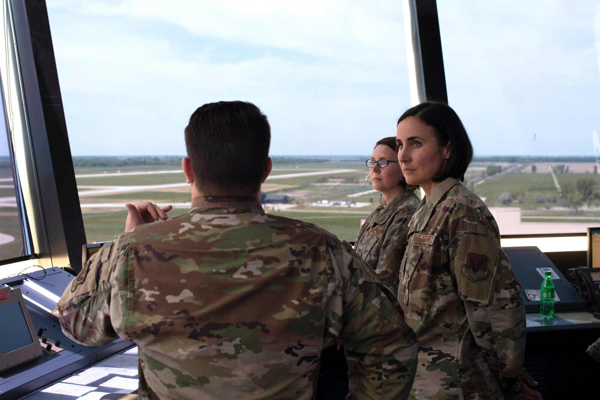 Chief Master Sgt. Summer Leifer, 25th Air Force command chief, listens to Senior Airman Matthew Mills, 319th Operations Support Squadron air traffic control journeyman, during a tour of the base air traffic control tower June 5, 2019, on Grand Forks Air Force Base, North Dakota. Leifer’s visit to Grand Forks AFB included a tour of the 319th Communications Squadron High Frequency Global Communications System, 319th Operations Support Squadron air traffic control tower and 69th Reconnaissance Group static display of an RQ-4 Global Hawk. (U.S. Air Force photo by Senior Airman Elora J. Martinez)