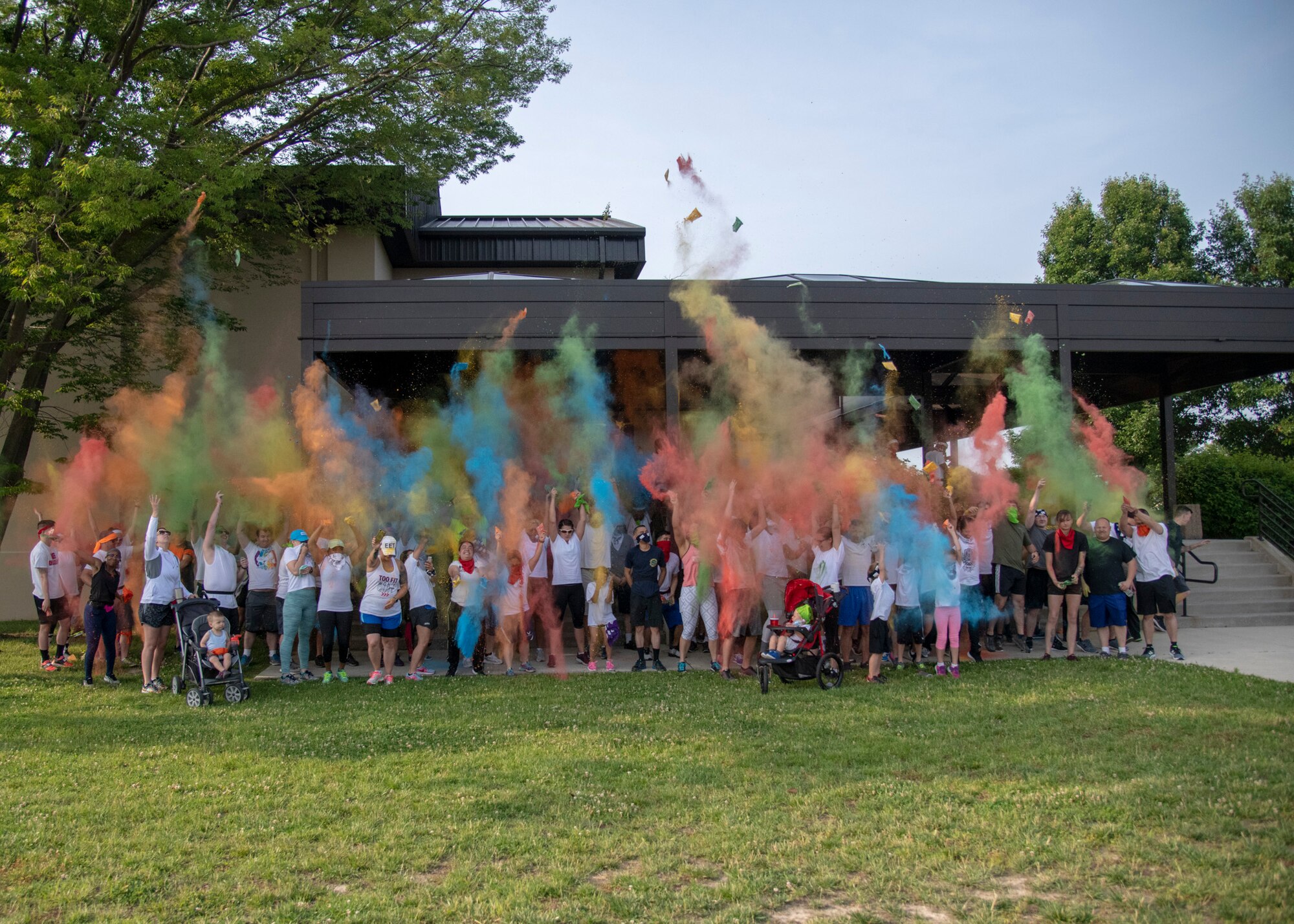 Participants of the Sexual Assault Awareness Month Color Run kick off the event by throwing color powder into the air June 5, 2019, at Dover Air Force Base, Del. The annual run is hosted by the Dover AFB Sexual Assault Prevention and Response team.  (U.S. Air Force photo by Staff Sgt. Esteban Esquivel)