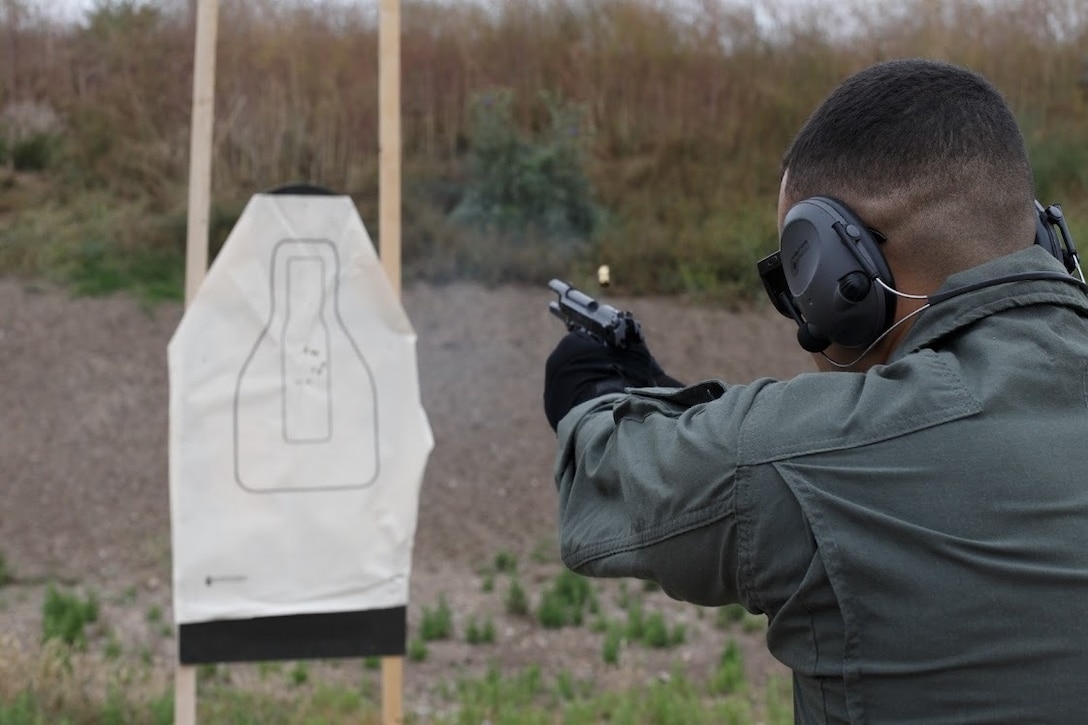 A Marine with the Marine Corps Air Station Miramar Special Reactions Team (SRT), fires the M1911 Service Pistol during training at MCAS Miramar, Calif., June 5. This training is regularly conducted to sharpen the Marines’ skills and further the Marine Corps’ mission of operational readiness. (U.S. Marine Corps photo by Lance Cpl. Cheng Chang)