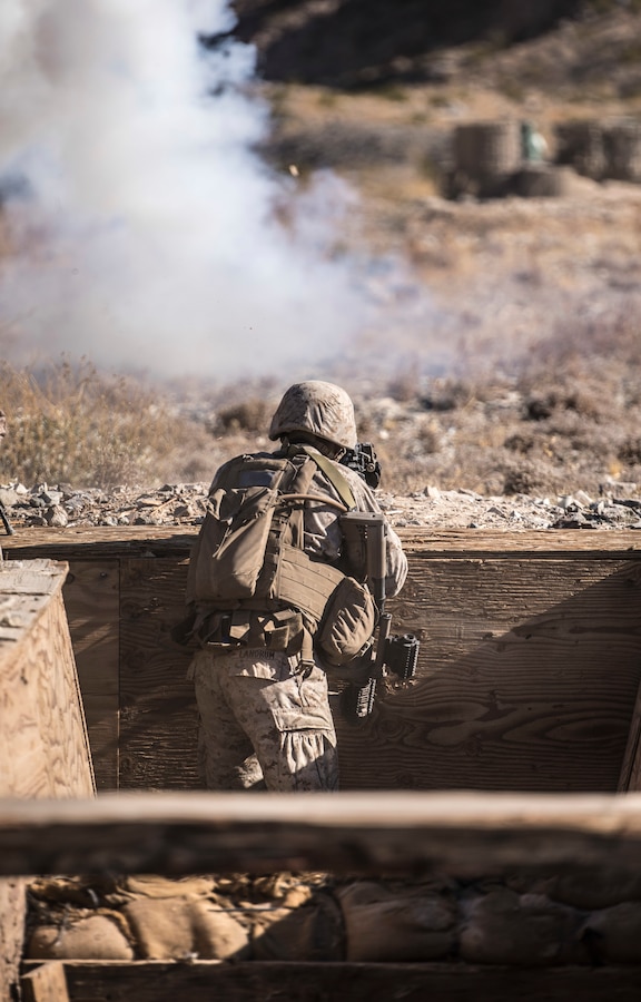A U.S. Marine with India Company, 3rd Battalion, 25th Marine Regiment, 4th Marine Division engages the enemy in a platoon attack on Range 410, an overhead fire infantry company training range, during Integrated Training Exercise 4-19 at Marine Corps Air Ground Combat Center Twentynine Palms, Calif., June 9, 2019. ITX 4-19 is an essential component of the Marine Forces Reserve training cycle. It serves as the principal exercise for assessing a unit’s readiness. (U.S. Marine Corps photo by Cpl. Tessa D. Watts)