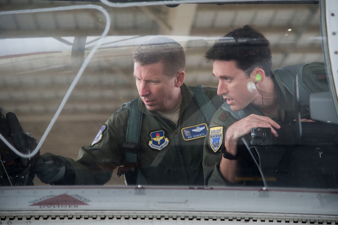 U.S. Air Force Maj. Gen. Patrick Doherty, 19th Air Force commander, and Maj. Lincoln Olsen, T-6 instructor pilot, conduct a T-6 Texan II safety check before conducting an operational demonstration at Joint Base San Antonio-Randolph, Texas, Feb. 21, 2018. Doherty was on the flight line getting test data first-hand during the command-wide T-6 operational pause. (U.S. Air Force photo by Sean Worrell)