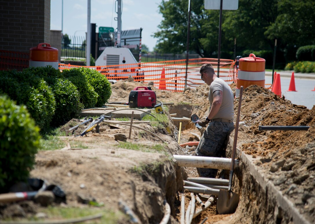 Airman 1st Class Keifer Donovan, 436th Civil
Engineer Squadron pavement and equipment
apprentice, takes a short rest after removing
dirt and rocks from a trench being dug near the
main gate June 3, 2019, Dover Air Force Base,
Del. Members of the shop are commonly
referred to as “Dirt Boyz,” because they are
typically working hands on with groundwork
projects. (U.S. Air Force photo by Airman 1st
Class Jonathan Harding)