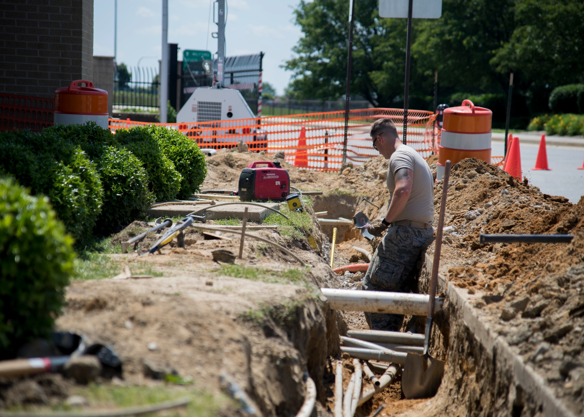 Airman 1st Class Keifer Donovan, 436th Civil
Engineer Squadron pavement and equipment
apprentice, takes a short rest after removing
dirt and rocks from a trench being dug near the
main gate June 3, 2019, Dover Air Force Base,
Del. Members of the shop are commonly
referred to as “Dirt Boyz,” because they are
typically working hands on with groundwork
projects. (U.S. Air Force photo by Airman 1st
Class Jonathan Harding)