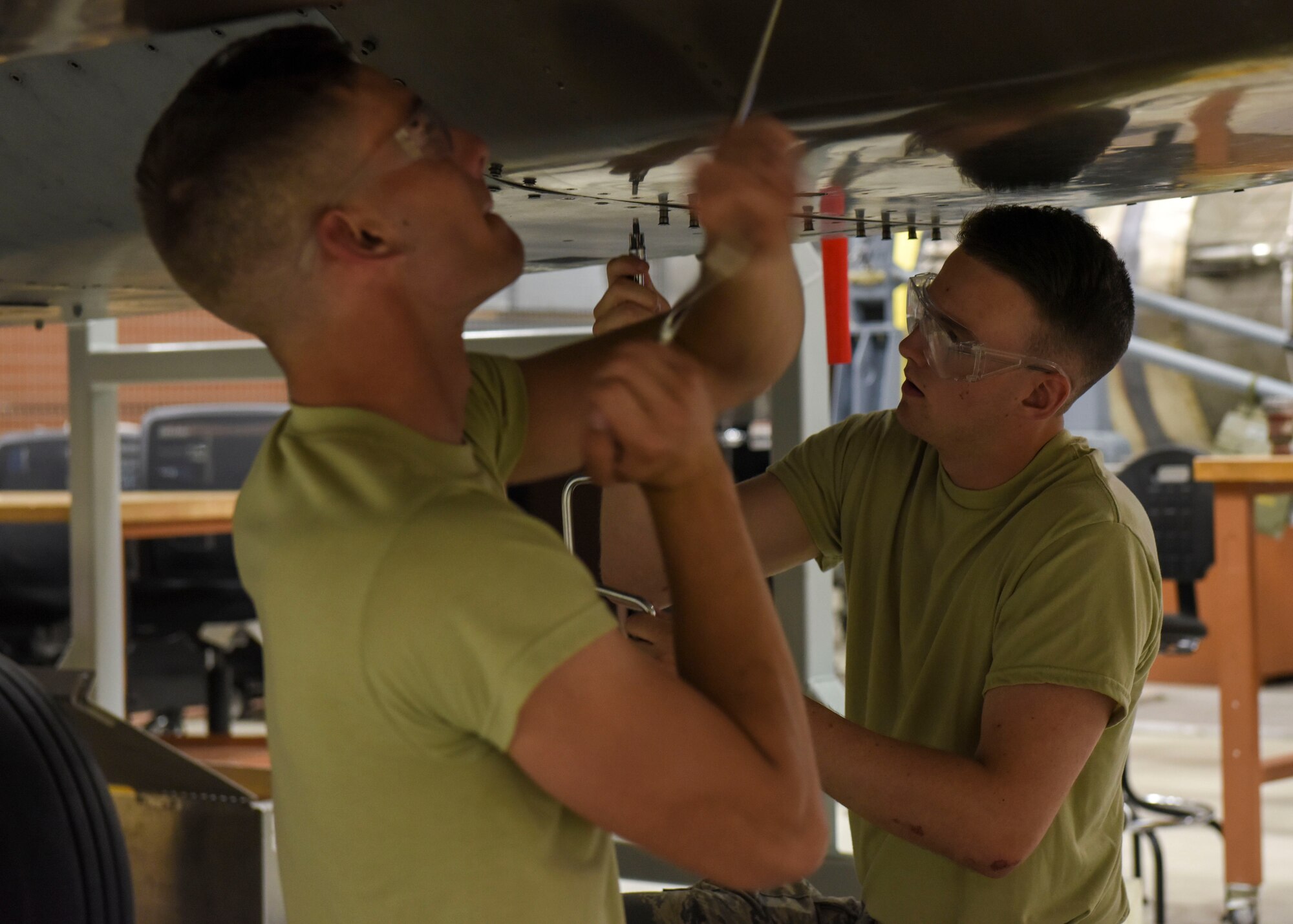 Airman 1st Class Daniel Hawkins (right), 361st Training Squadron aerospace propulsion apprentice, prepares a McDonnell Douglas F-15 Eagle for engine removal at Sheppard Air Force Base, Texas, Jun. 10, 2019. Hawkins, an ACE award recipient, received a score of 100% on all of his progress checks and block tests during his training course. Hawkins enjoys the challenges that along come with his job. (U.S. Air Force photo by Senior Airman Ilyana A. Escalona)