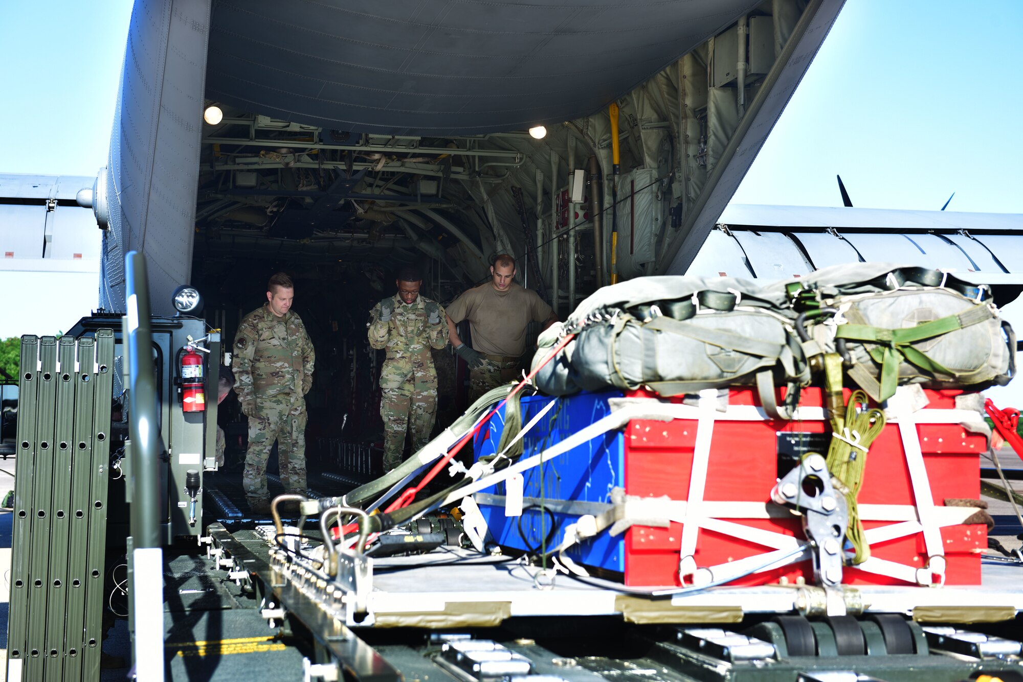 A commemorative pallet is loaded to an aircraft.