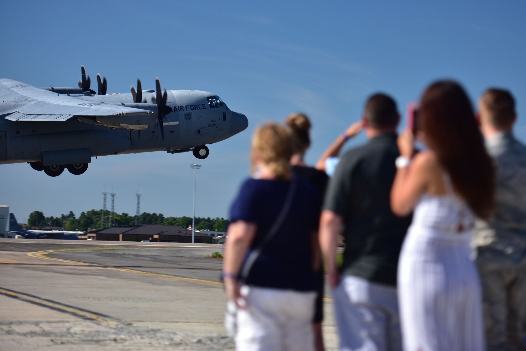 People watch an aircraft take off.