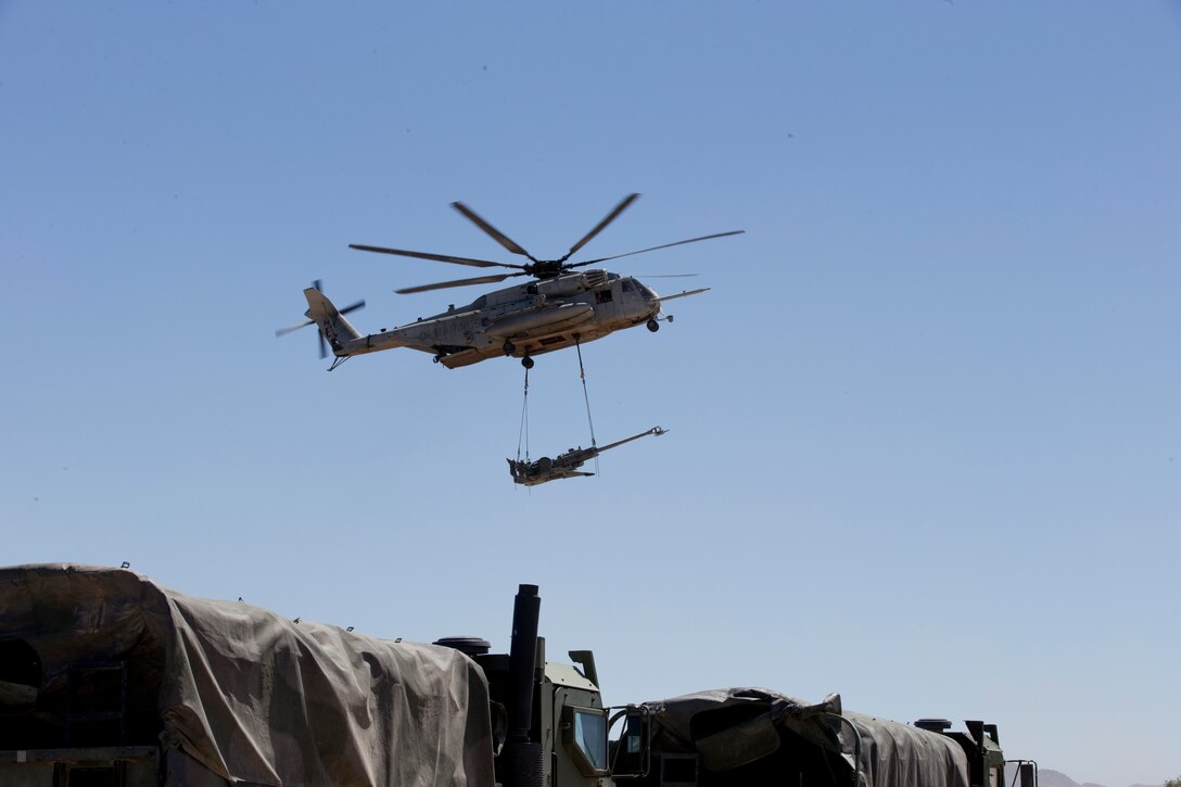 A CH-53E Super Stallion delivers artillery as part of Weapons and Tactics Instructor (WTI) course 2-19 in Yuma Ariz., April 17, 2019. WTI is a seven week training event hosted by Marine Aviation Weapons and Tactics Squadron One, which emphasizes operational integration of the six functions of Marine Corps aviation in support of a Marine Air Ground Task Force. (U.S. Marine Corps photo by Lance Cpl. Andres Hernandez)