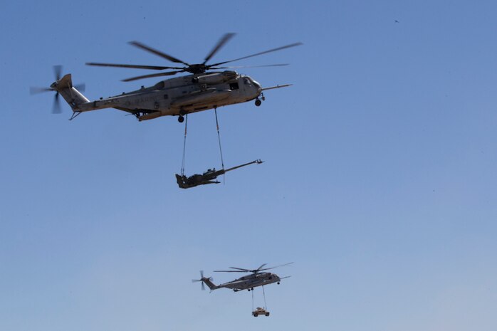 A CH-53E Super Stallion delivers artillery as part of Weapons and Tactics Instructor (WTI) course 2-19 in Yuma Ariz., April 17, 2019. WTI is a seven week training event hosted by Marine Aviation Weapons and Tactics Squadron One, which emphasizes operational integration of the six functions of Marine Corps aviation in support of a Marine Air Ground Task Force. (U.S. Marine Corps photo by Lance Cpl. Andres Hernandez)