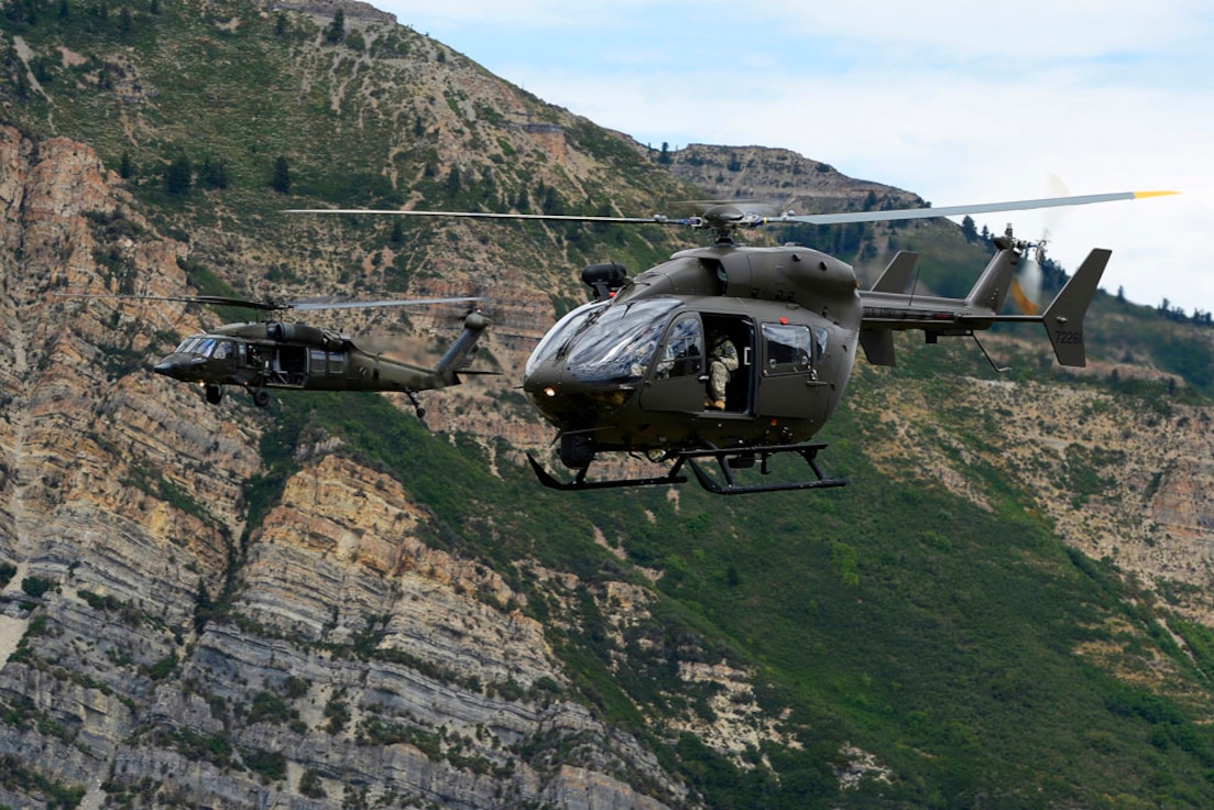 Members of the 2-211 Aviation Battalion return from Grand Junction, Colorado July 29, 2013 to assist in the delivery of two UH-72 Lakota helicopters. The UH-72s will help accomplish  some of the same missions the 2-211 performs with the UH-60 but at with a reduction in operating costs( U.S. Air Force photo\ Tim Chacon)