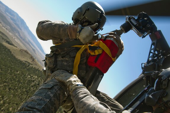 U.S. Army Sgt. Jason Townsen, a flight instructor, and Sgt. Nathan McLaughlin, a standardization instructor, from C. co. 1-171 MEDEVAC, Utah Army National Guard, West Jordan, Utah, participate in a search and rescue training exercise, a lost hiker, on Camp W.G. Williams, Riverton, Utah on April 3, 2012.  (U.S. Air Force photo by Tech. Sgt. Dennis J. Henry Jr./Released)