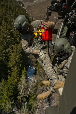 U.S. Army Sgt. Jason Townsen, a flight instructor, and Sgt. Nathan McLaughlin, a standardization instructor, from C. co. 1-171 MEDEVAC, Utah Army National Guard, West Jordan, Utah, participate in a search and rescue training exercise, a lost hiker, on Camp W.G. Williams, Riverton, Utah on April 3, 2012.  (U.S. Air Force photo by Tech. Sgt. Dennis J. Henry Jr./Released)