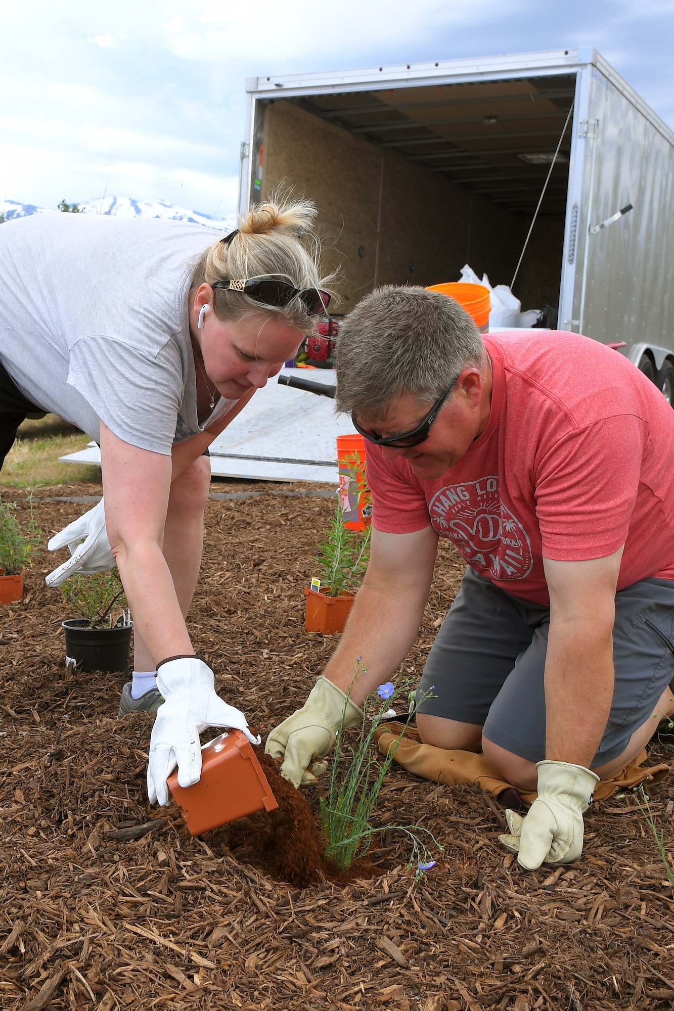 (left to right) Michelle Cottle and Russ Lawrence, both 75th Civil Engineering Group, plant vegetation at the new pollinator garden plot, June 6, 2019, at Hill Air Force Base, Utah. The garden will provide food and habitat for pollinator species such as hummingbirds, bees, and other insects, which are critical to maintaining diverse and healthy ecosystems. (U.S. Air Force photo by Todd Cromar)