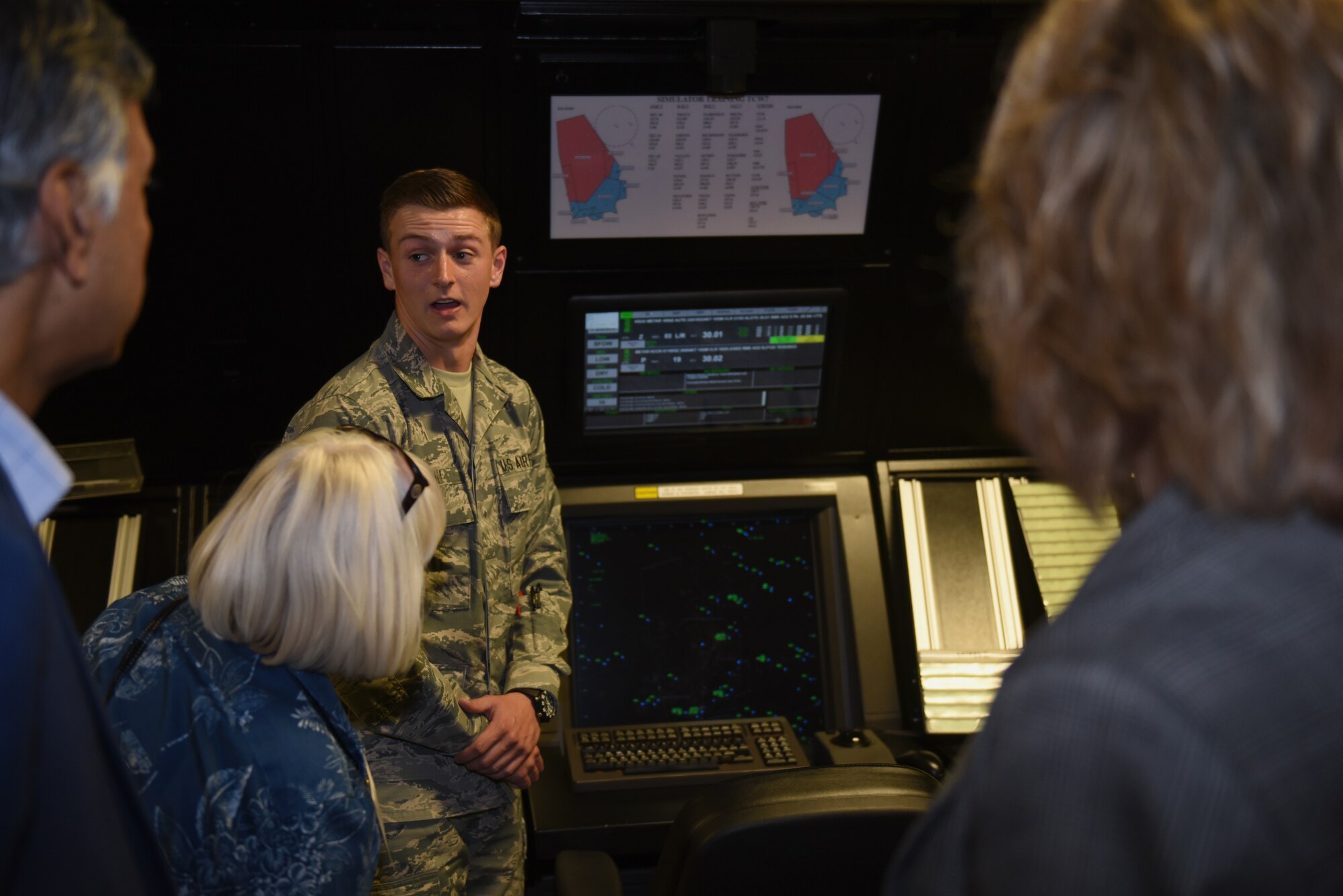 U.S. Air Force Airman 1st Class Jordan Hamlin, 60th Operations Support Squadron air traffic controller apprentice, explains how to read a radar to Honorary Commanders June 7, 2019, at Travis Air Force Base, California. The purpose of the Travis’ Honorary Commander Program is to promote relationships between base senior leadership and civilian partners, foster civic appreciation of the Air Force mission and its Airmen, maximize opportunities to share the Air Force story with new stewards and to communicate mutual interest, challenges and concerns that senior leaders and civilian stakeholders have in common. (U.S. Air Force photo by Airman 1st Class Cameron Otte)
