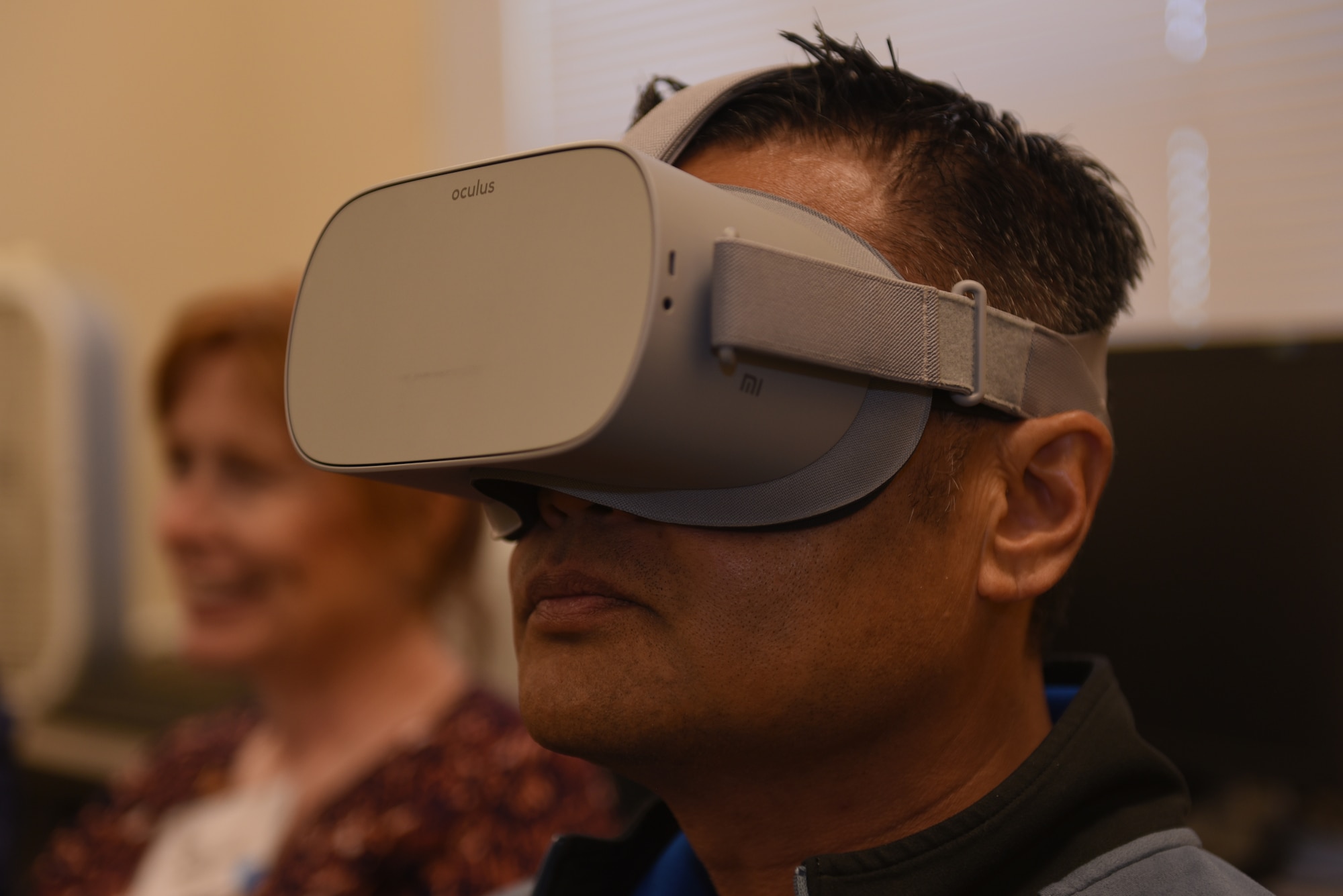 Honorary Commander Kris Concepcion wears a virtual reality helmet that simulates a pilot training video June 7, 2019, at Travis Air Force Base, California. The purpose of the Travis’ Honorary Commander Program is to promote relationships between base senior leadership and civilian partners, foster civic appreciation of the Air Force mission and its Airmen, maximize opportunities to share the Air Force story with new stewards and to communicate mutual interest, challenges and concerns that senior leaders and civilian stakeholders have in common. (U.S. Air Force photo by Airman 1st Class Cameron Otte)