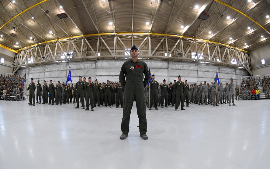 Col. James Price, 432nd Wing/432nd Air Expeditionary Wing vice commander, stands at parade rest in front of 432nd WG/432nd AEW Airmen during the 432nd WG/432nd AEW change of command ceremony at Creech Air Force Base, Nevada, June 7, 2019. Col. Stephen Jones assumed command of the Remotely Piloted Aircraft Wing from Col. Julian Cheater as Maj. Gen. Andrew Croft, Twelfth Air Force (Air Forces Southern) commander, presided over the event. (U.S. Air Force photo by Staff Sgt. James Thompson)