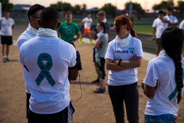 U.S. Marines stationed at Marine Corps Air Station (MCAS) Yuma take part in the Sexual Assault Prevention and Response color run on MCAS Yuma, Ariz., April 25, 2019. The 5 kilometer run took place in April, in order to support Sexual Assault Awareness Month. (U.S. Marine Corps photo by Pfc. John Hall)