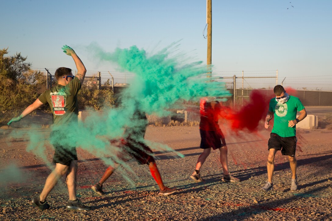 U.S. Marines stationed at Marine Corps Air Station (MCAS) Yuma take part in the Sexual Assault Prevention and Response color run on MCAS Yuma, Ariz., April 25, 2019. The 5 kilometer run took place in April, in order to support Sexual Assault Awareness Month. (U.S. Marine Corps photo by Pfc. John Hall)