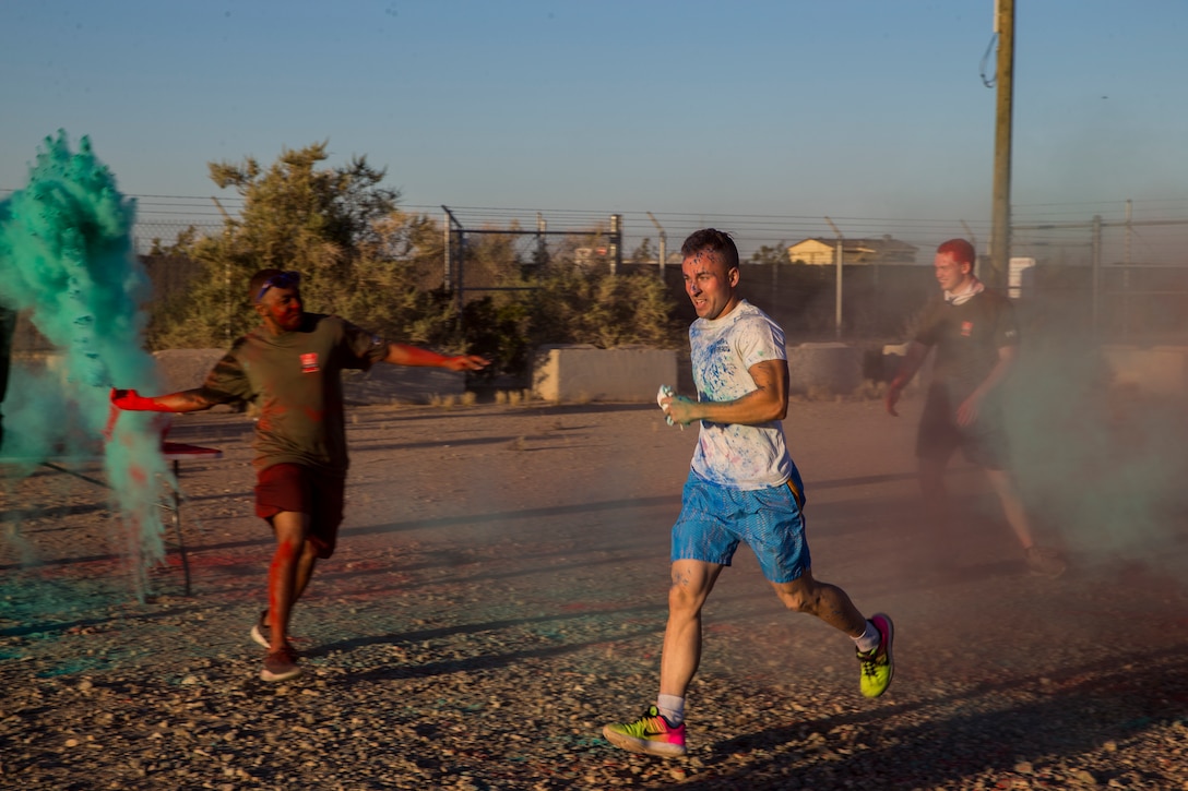 U.S. Marines stationed at Marine Corps Air Station (MCAS) Yuma take part in the Sexual Assault Prevention and Response color run on MCAS Yuma, Ariz., April 25, 2019. The 5 kilometer run took place in April, in order to support Sexual Assault Awareness Month. (U.S. Marine Corps photo by Pfc. John Hall)