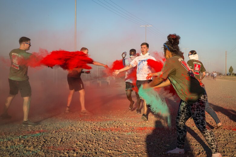 U.S. Marines stationed at Marine Corps Air Station (MCAS) Yuma take part in the Sexual Assault Prevention and Response color run on MCAS Yuma, Ariz., April 25, 2019. The 5 kilometer run took place in April, in order to support Sexual Assault Awareness Month. (U.S. Marine Corps photo by Pfc. John Hall)