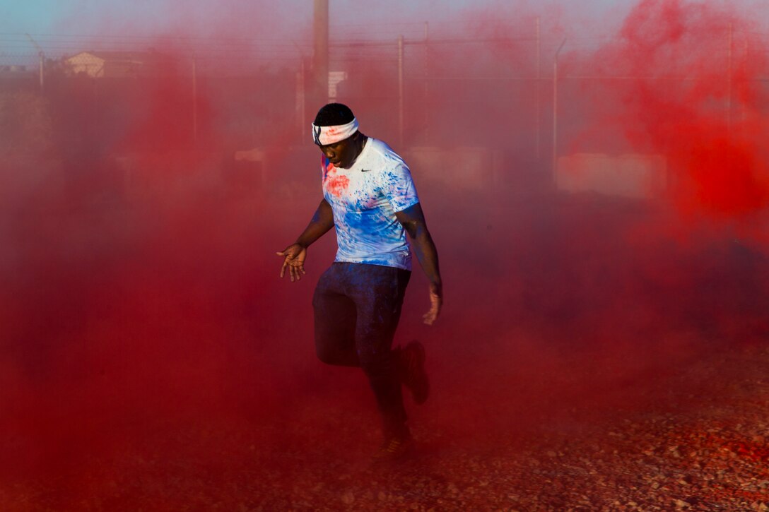 U.S. Marines stationed at Marine Corps Air Station (MCAS) Yuma take part in the Sexual Assault Prevention and Response color run on MCAS Yuma, Ariz., April 25, 2019. The 5 kilometer run took place in April, in order to support Sexual Assault Awareness Month. (U.S. Marine Corps photo by Pfc. John Hall)