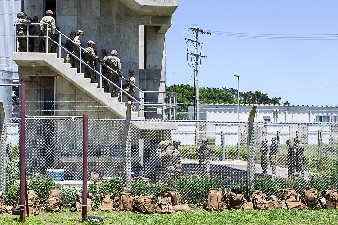 Marines with Battalion Landing Team, 2nd Battalion, 1st Marines, line up during fast rope training at Camp Schwab, Okinawa, Japan, May 21, 2019. BLT 2/1 is the Ground Combat Element for the 31st Marine Expeditionary Unit. The 31st MEU, the Marine Corps' only continuously forward-deployed MEU partnering with the U.S. Navy's Amphibious Squadron 11, provides a flexible and lethal force ready to perform a wide range of military operations as the premier crisis response force in the Indo-Pacific region. (U.S. Marine Corps photo by Gunnery Sgt. T. T. Parish/Released)