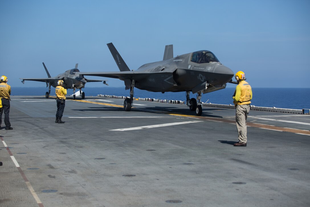 F-35B Lightning II fighter aircraft, with Marine Medium Tiltrotor Squadron 265 (Reinforced) standby during flight operations while underway in the Philippine Sea, June 5, 2019. The 31st MEU, the Marine Corps` only continuously forward-deployed MEU, provides a flexible and lethal force ready to perform a wide range of military operations as the premier crisis response force in the Indo-Pacific region. (Official U.S. Marine Corps photo by Lance Cpl. Kenny Nunez Bigay)