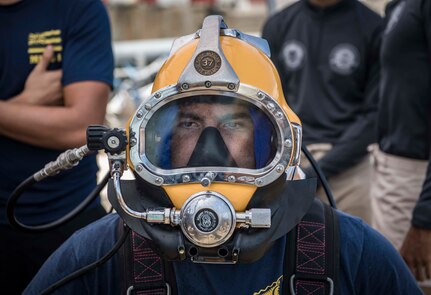 SATTAHIP NAVAL BASE, Thailand (June 4, 2019) U.S. Navy Diver 2nd Class Stephen Collister, assigned to Mobile Diving and Salvage Unit (MDSU) 1, prepares for a dive with the Royal Thai Navy while aboard the Military Sealift Command Safeguard-class salvage ship USNS Salvor (T-ARS 52) during Cooperation Afloat Readiness and Training (CARAT) Thailand 2019. This year marks the 25th iteration of CARAT, a multinational exercise series designed to enhance U.S. and partner navies’ abilities to operate together in response to traditional and non-traditional maritime security challenges in the Indo-Pacific region.