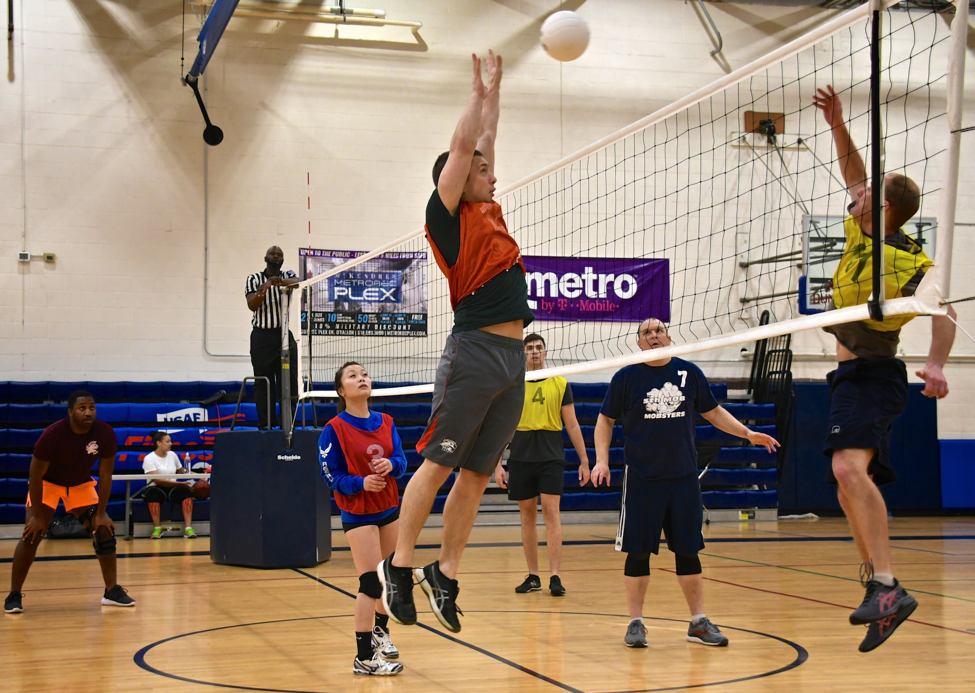Staff Sgt. Tyler Hambidge, 932nd Medical Squadron, blocks the volleyball back over the net during recent intramural competition at Scott Air Force Base, Ill.  The 932nd Airlift Wing has volunteers participating in a variety of  sports throughout the year, to include volleyball and summer softball.  (U.S. Air Force photo by Lt. Col. Stan Paregien)