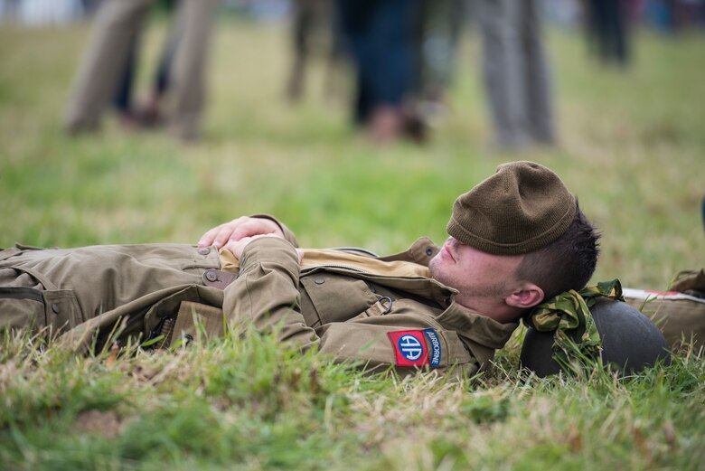 French local, Louis Boyer, parachutist, gets a moment of shut-eye after jumping from a C-47 Skytrain and landing into the Iron Mike drop-zone outside Sainte-Mère-Église, France, June 9, 2019. Boyer, 17, was the youngest individual, out of over 1,000 paratroopers and parachutists, to participate in the D-Day 75 Commemorative Airborne Operation -- it was also the first time Boyer had jumped from a C-47. (U.S. Air Force photo by Senior Airman Kristof J. Rixmann)