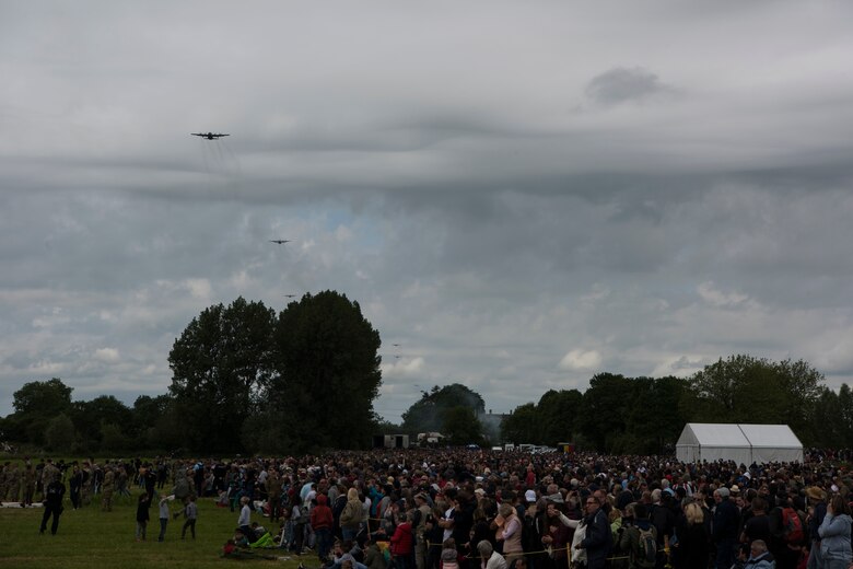 Thousands of spectators gather to see the D-Day 75 Commemorative Airborne Operation honoring the airborne operation launched on D-Day, June 6, 1944, outside Sainte-Mère-Église, France, June 9, 2019. In total, over 900 military paratroopers and 110 civilian parachutists from seven countries participated in what is known to be the second largest airborne operation since WWII. (U.S. Air Force photo by Senior Airman Kristof J. Rixmann)