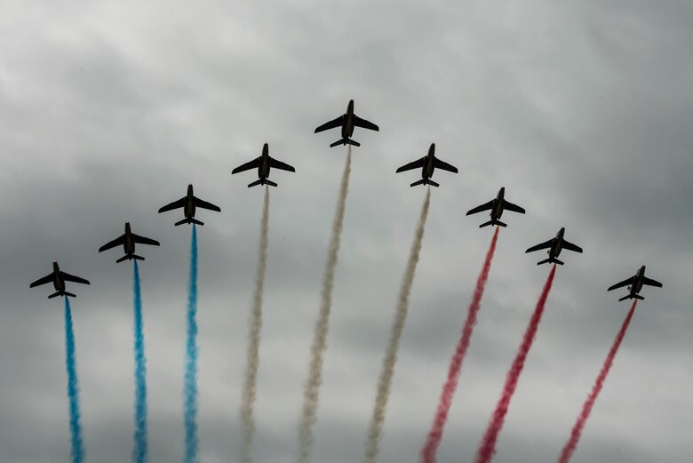 The Patrouille de France, the French Air Force aerial demonstration team, conducts a flight over Iron Mike Drop Zone, outside of Saint-Mere-Eglise, France June 9, 2019. The D-Day 75 Commemorative Airborne Operation consisted of flyovers and over one thousand personnel drops into the drop zone, in honor of Operation Overlord, June 6, 1944. (U.S. Air Force photo by Senior Airman Devin M. Rumbaugh)
