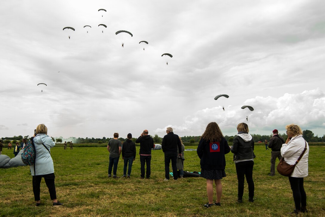 Military-free-fall parachutist prepare to land at Iron Mike Drop Zone outside of Sainte-Mère-Église, France June 9, 2019. The parachutists were from six European nations and members of the U.S. military. (U.S. Air Force photo by Senior Airman Devin M. Rumbaugh)
