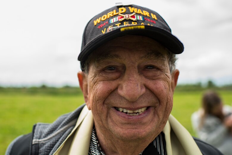 U.S. Army Staff Sgt. Irving Locker, a World War II veteran who was assigned to the 160th Antiaircraft Artillery Gun Battalion, 4th Division, 1st Army, smiles for a photo June 9, 2019. Locker was part of the invasion force who stormed the beaches of Normandy 75 years ago. (U.S. Air Force photo by Senior Airman Devin M. Rumbaugh)