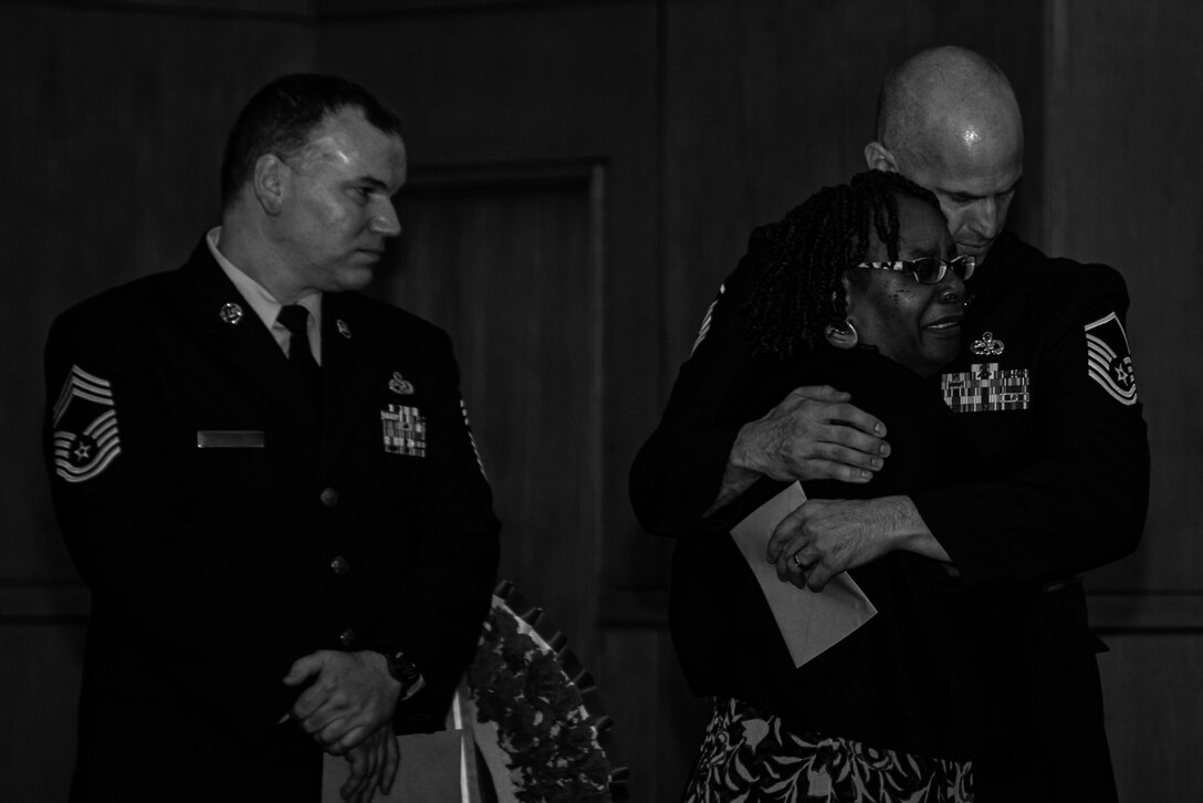 Jennifer Hall, Senior Airman Aaron Hall’s mother, embraces a member of her son’s leadership during a memorial service at the Palmetto Chapel at Shaw Air Force Base, South Carolina, June 5, 2019.