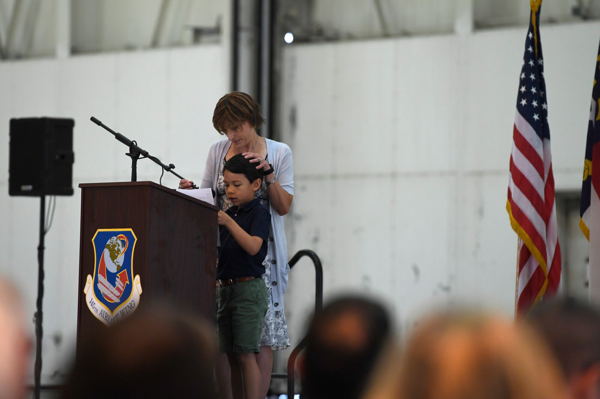 Rob David, son of fallen U.S. Air Force Maj. Ryan S. David, delivers a speech during the Building Dedication Ceremony in honor of his father and three other members of the Modular Airborne Fire Fighting System (MAFFS) seven crew at the North Carolina Air National Guard Base, Charlotte Douglas International Airport, June 9, 2019. The four Airmen tragically lost their lives seven years ago in the MAFFS seven accident while fighting fires in South Dakota. These Airmen are remembered with a building dedication ceremonies to honor their legacy for years to come.