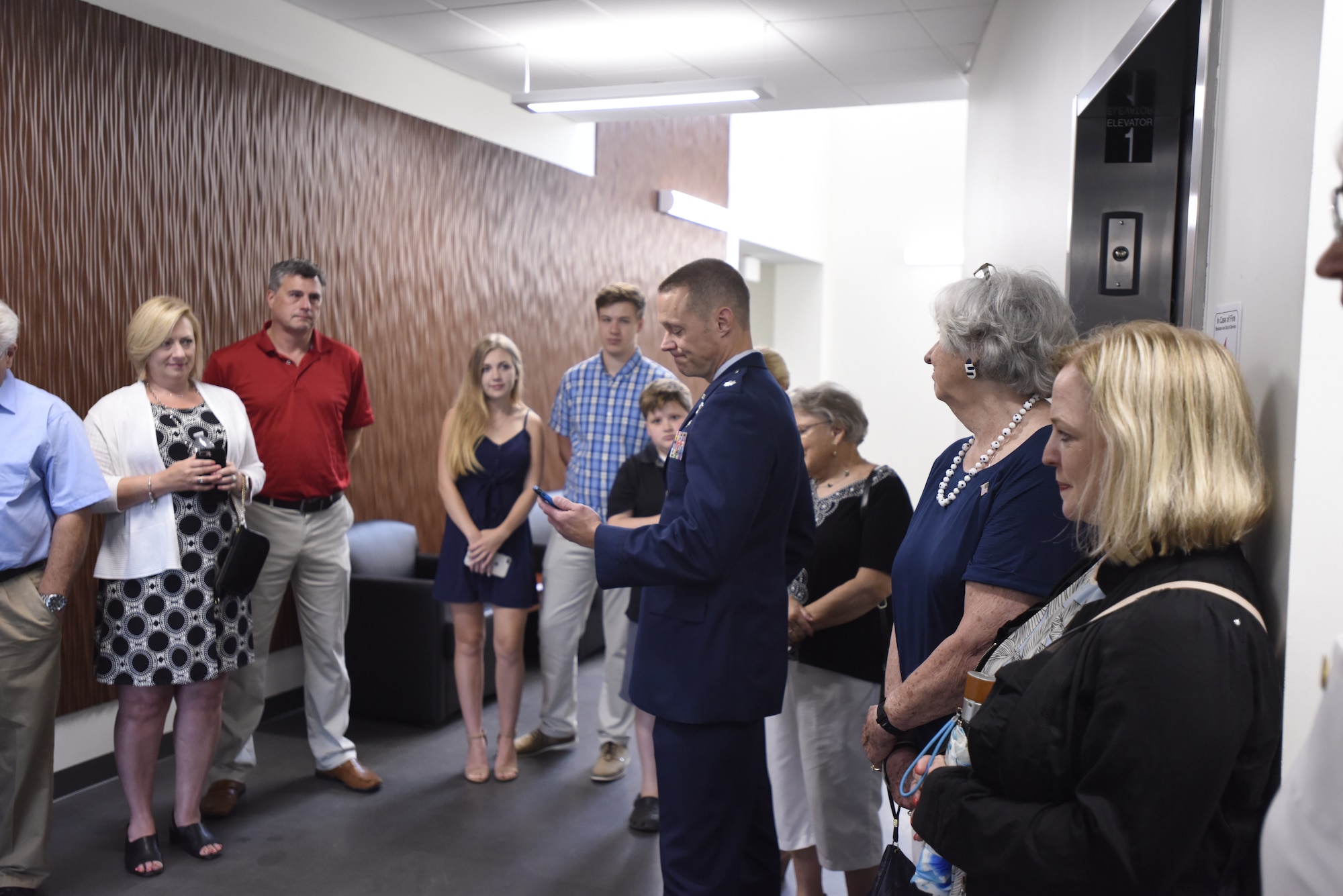 U.S. Air Force Lt. Col. James Pearson reads an emotional note to the family of Lt. Col. Joseph Mikeal, as they tour the 145th Airlift Wing’s new state of the art operations building that now shares his name, at the North Carolina Air National Guard Base, Charlotte Douglas International Airport, June 9, 2019. Lt. Col. Mikeal tragically lost his life alongside 3 other C-130 crew members in the MAFFS 7 aircraft accident in 2012, the 145th Airlift Wing honored his and the other crew members sacrifice by naming four buildings across the wing after each one.
