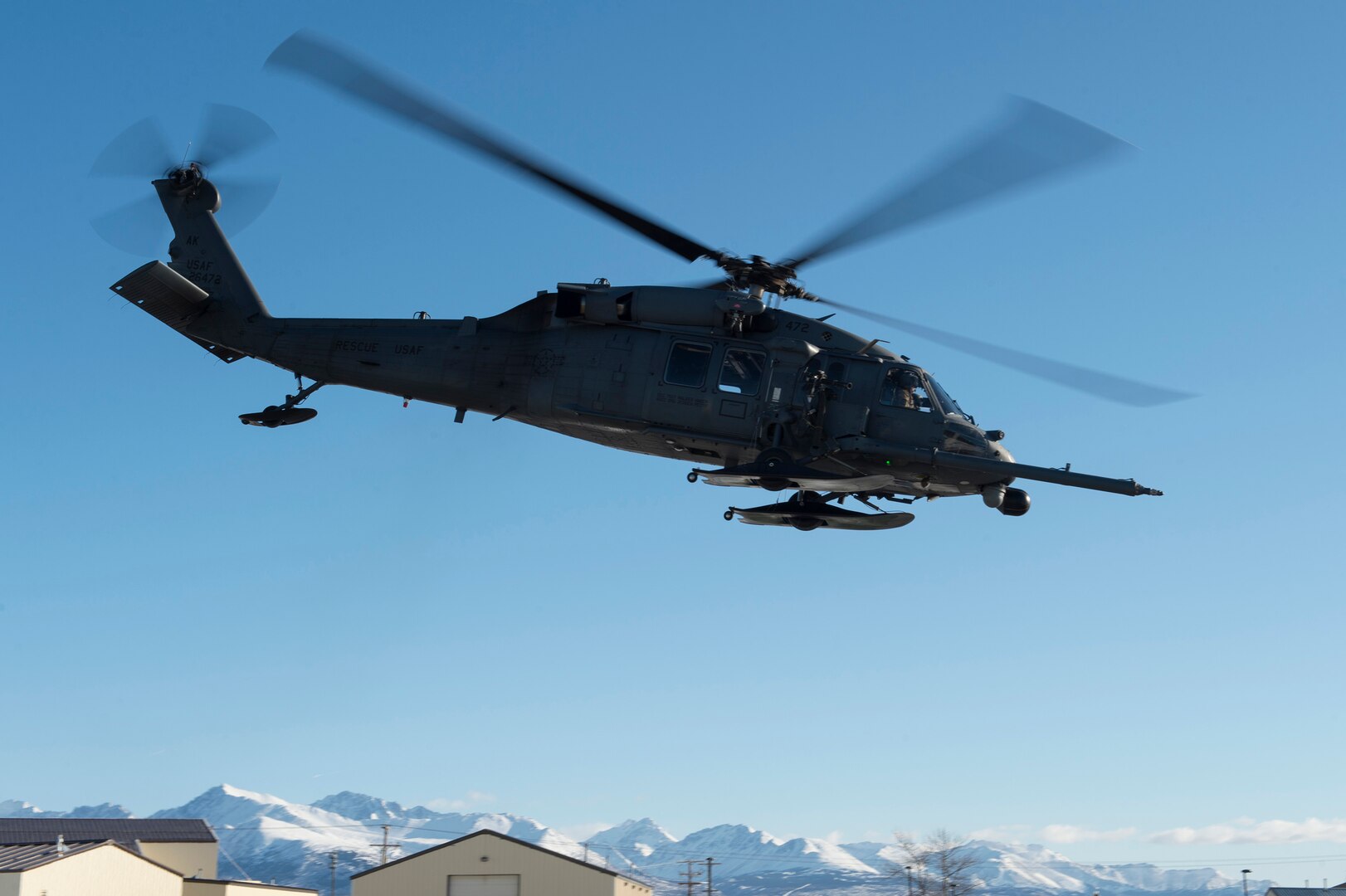 An HH-60G Pave Hawk helicopter operated by Alaska Air National Guardsmen with the 210th Rescue Squadron takes off for aerial live-fire gunnery training at Joint Base Elmendorf-Richardson, Alaska, March 19, 2019. A similar aircraft helped rescue a person mauled by a bear on June 10, 2019.