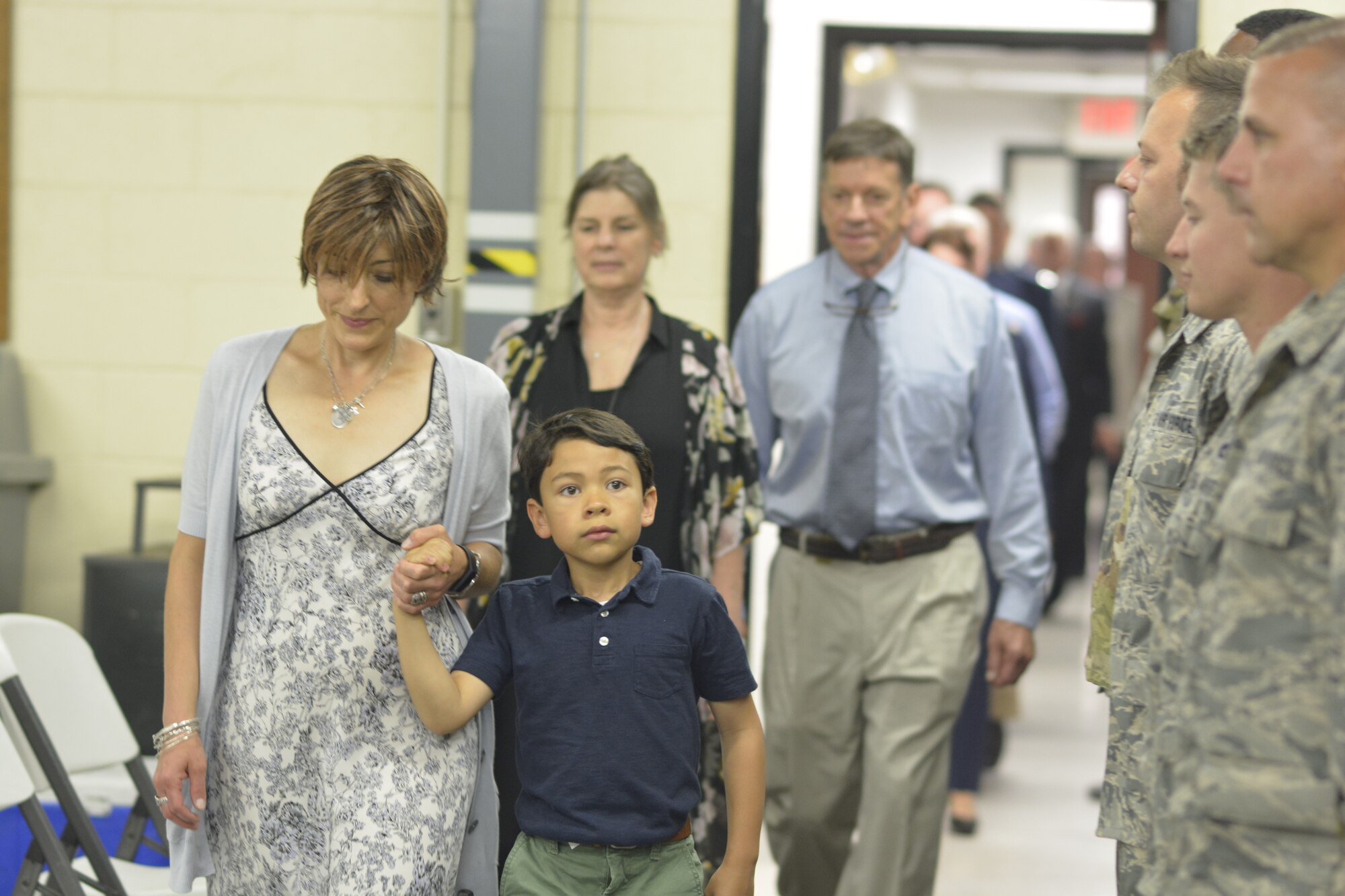 Members of the 145th Airlift Wing Small Air Terminal stand at attention for the family of U.S. Air Force Maj. Ryan S. David as they enter the building for the first time following it’s dedication ceremony, at the North Carolina Air National Guard Base, Charlotte Douglas International Airport, June 9, 2019. The 145th Airlift Wing dedicated four buildings across the base to the fallen members of the MAFFS aircrew, including Maj. David, who passed away in 2012 following an accident while fighting a wild fire in South Dakota.