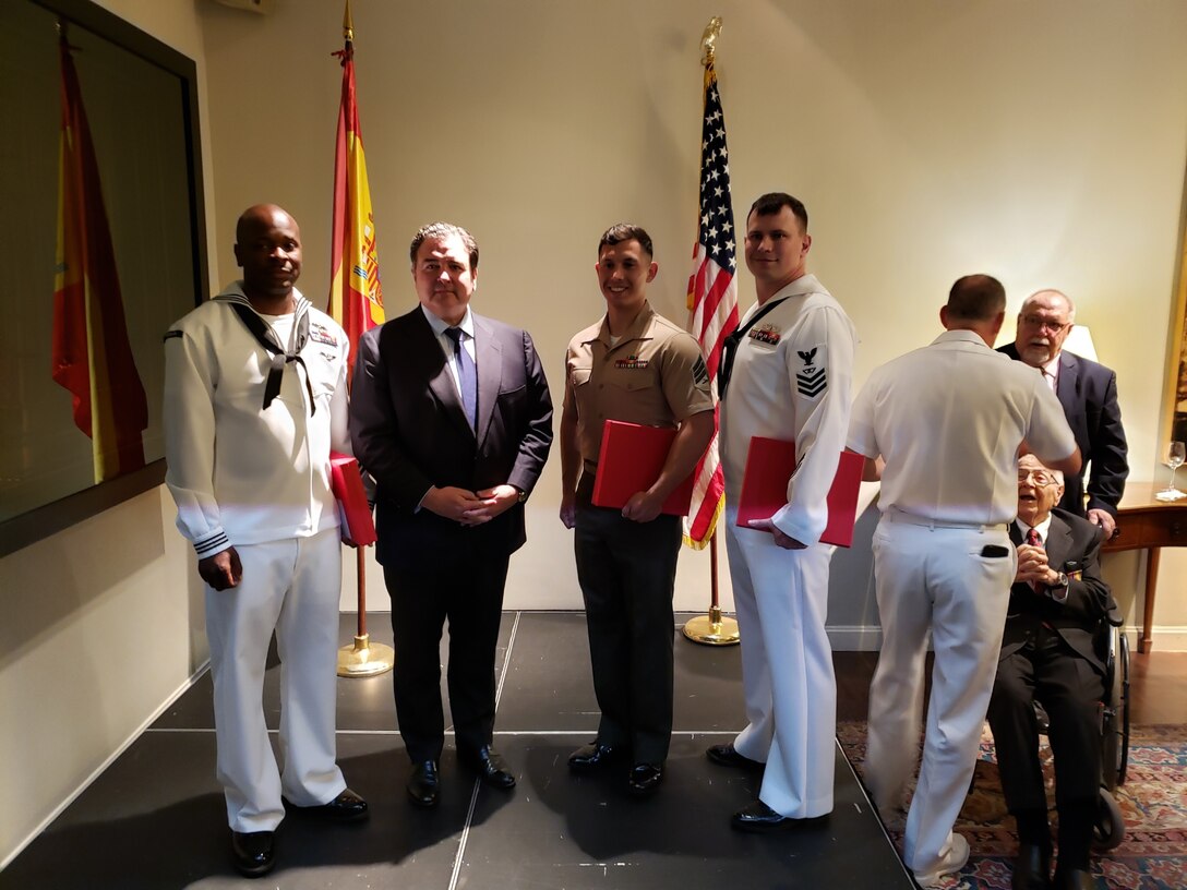 U.S. Marine Sgt. Jose Araya, an imagery analysis specialist, with Special Purpose Marine Air-Ground Task Force-Crisis Response-Africa 19.2, Marine Forces Europe and Africa, poses for a photo with Ambassador Duke Buchan III, United States Ambassador to Spain and Andorra, and other award recipients at the U.S. Embassy in Madrid, Spain, May 20, 2019. Araya was awarded the Moron Chapter and U.S. Navy League Marine of the Year award. The award is presented annually to a Marine who encompasses not just the “whole Marine concept,” but also admirable traits outside of uniform. (Photo by unknown source)